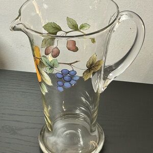 Mikasa Garden Harvest clear glass pitcher with an embossed fruit design.